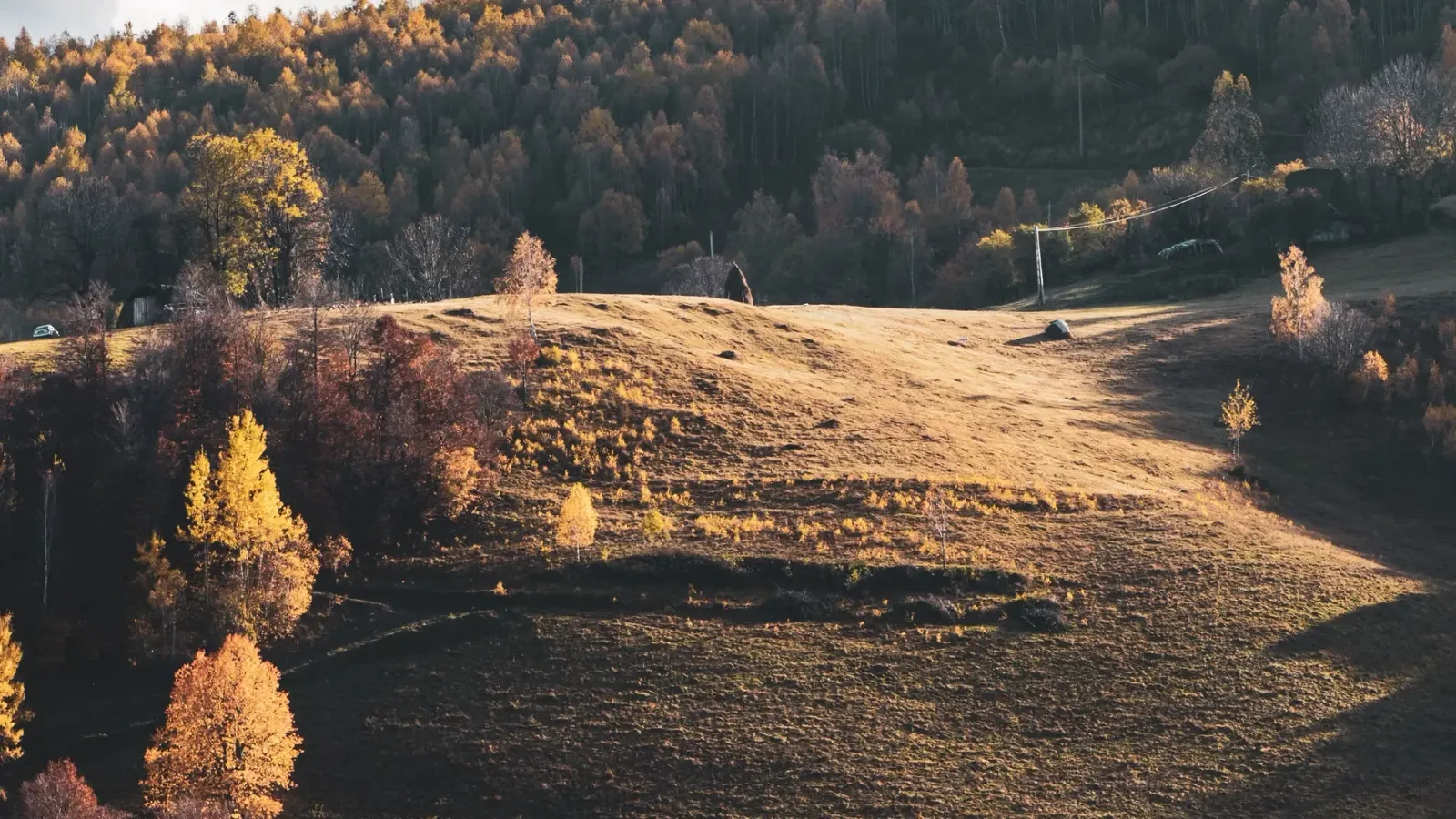 Hills and forests in autumn colours in the Romanian countryside