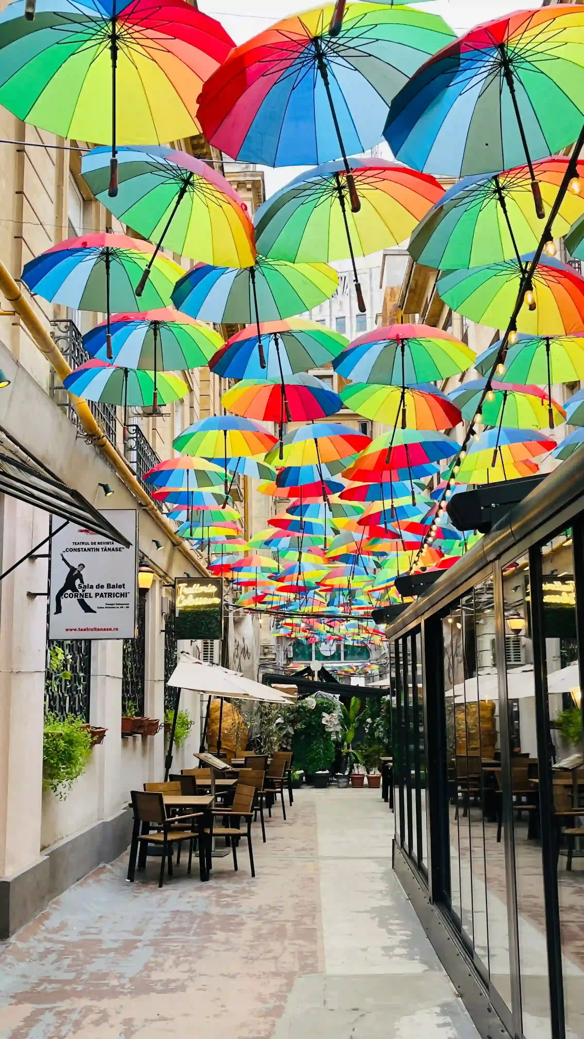 Colourful umbrellas suspended above a pedestrian street in Bucharest