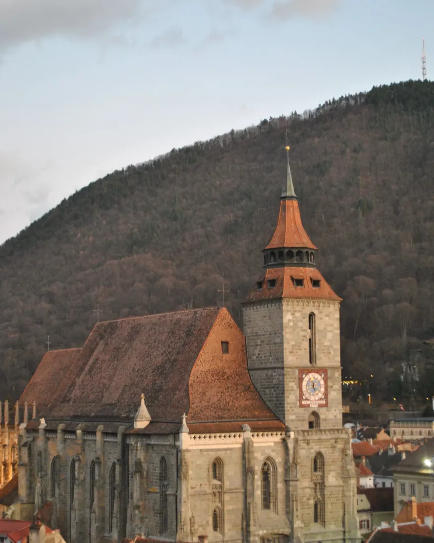 The Black Church of Brașov with its clock tower and Mount Tâmpa behind