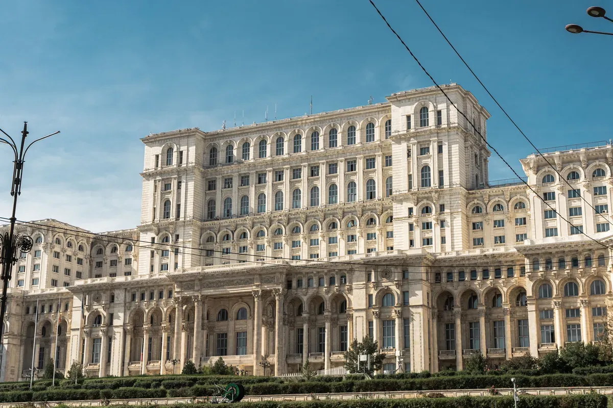The Palace of the Parliament in Bucharest under a blue sky