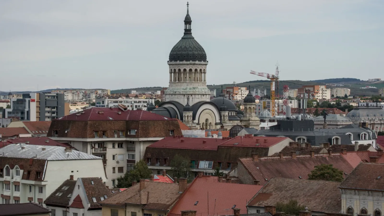The rooftops of Cluj-Napoca with the dome of the Orthodox Cathedral rising above them