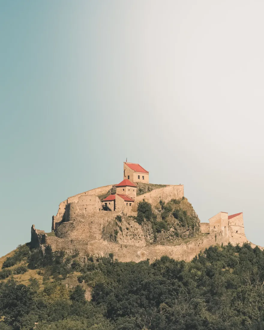 Rupea Fortress on a green hill in Transylvania