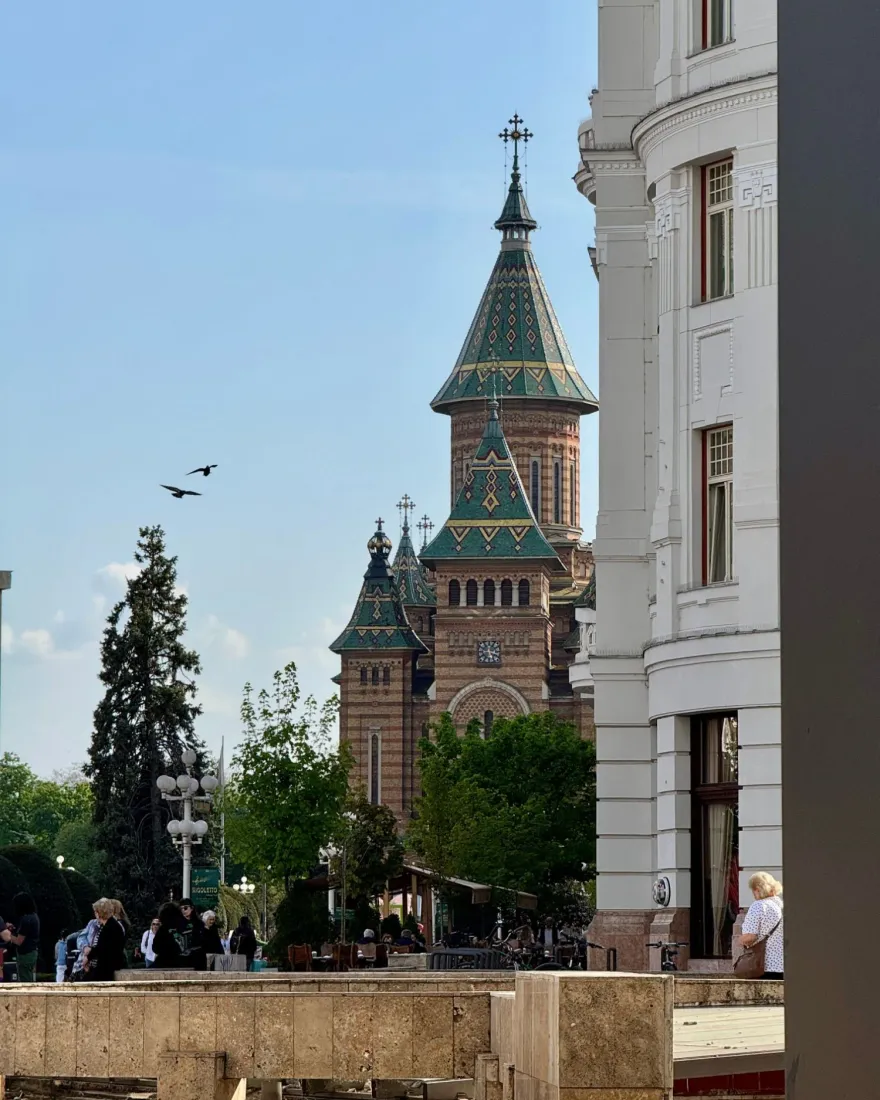 The colourful tiled towers of the Metropolitan Orthodox Cathedral seen from Victory Square in Timișoara